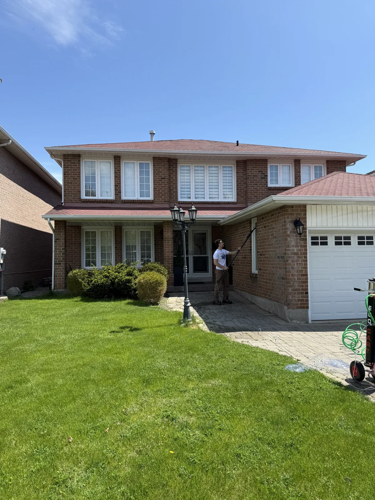 ShinePro cleaning windows at a residential property