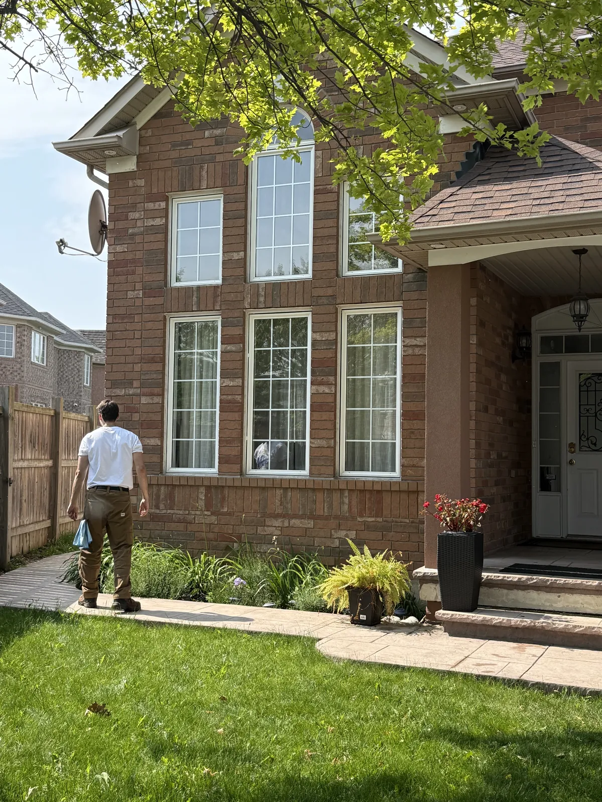Exterior ladder work at a residential property by ShinePro